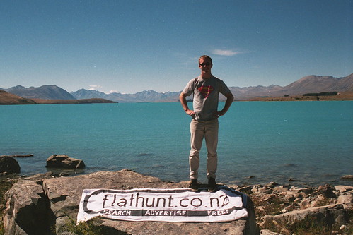 David Randal with the homemade Flathunt banner, Lake Tekapo, 2000